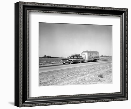 1960s-1970s Family Station Wagon and Camping Trailer Driving on Country Highway on Vacation-null-Framed Photographic Print