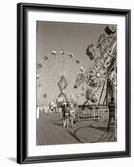 1960s Group of Teens Looking at Amusement Rides on Pier-null-Framed Photographic Print