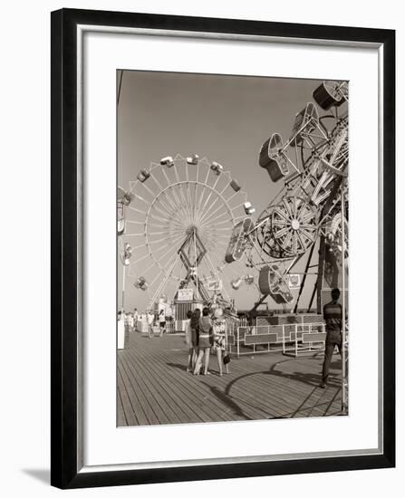 1960s Group of Teens Looking at Amusement Rides on Pier-null-Framed Photographic Print