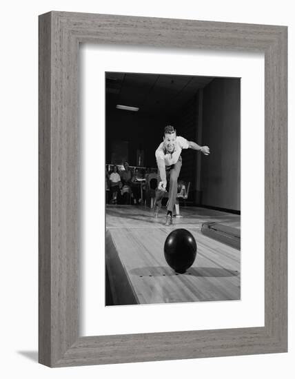 1960s MAN RELEASING BALL DOWN BOWLING ALLEY LANE-H. Armstrong Roberts-Framed Photographic Print