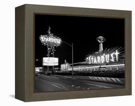 1960s Night Scene of the Stardust Casino Las Vegas,, Nevada-null-Framed Premier Image Canvas