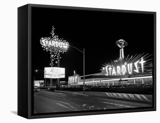 1960s Night Scene of the Stardust Casino Las Vegas,, Nevada-null-Framed Premier Image Canvas