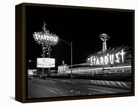 1960s Night Scene of the Stardust Casino Las Vegas,, Nevada-null-Framed Premier Image Canvas