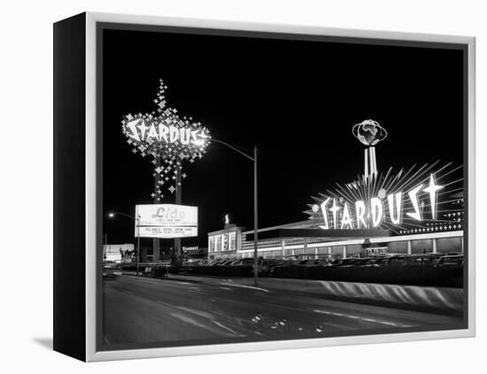 1960s Night Scene of the Stardust Casino Las Vegas,, Nevada-null-Framed Premier Image Canvas