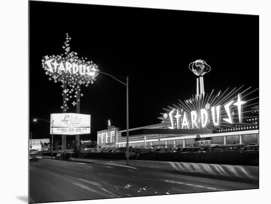 1960s Night Scene of the Stardust Casino Las Vegas,, Nevada-null-Mounted Photographic Print