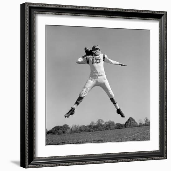 1960s QUARTERBACK JUMPING AND THROWING PASS FOOTBALL-H. Armstrong Roberts-Framed Photographic Print