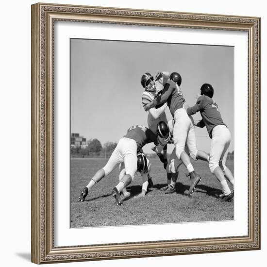 1960s SIX MEN PLAYING FOOTBALL GROUP TACKLE-H. Armstrong Roberts-Framed Photographic Print