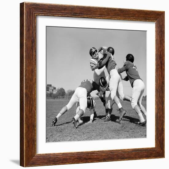 1960s SIX MEN PLAYING FOOTBALL GROUP TACKLE-H. Armstrong Roberts-Framed Photographic Print