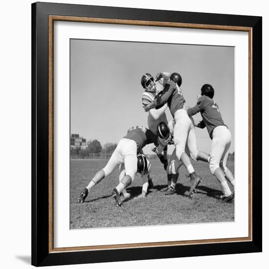 1960s SIX MEN PLAYING FOOTBALL GROUP TACKLE-H. Armstrong Roberts-Framed Photographic Print