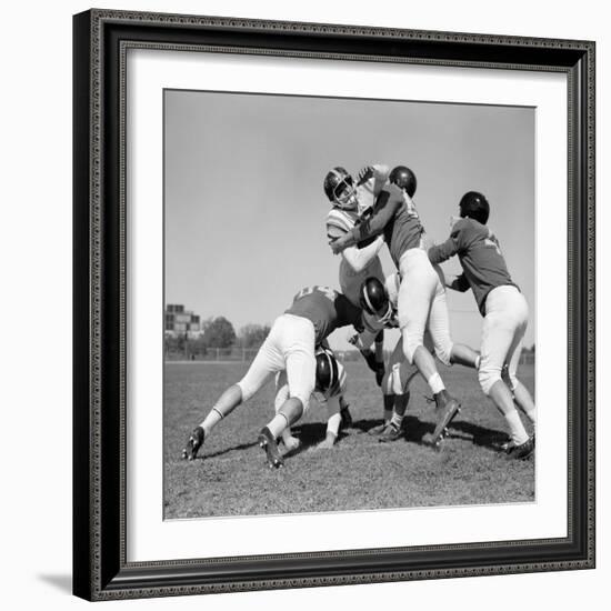 1960s SIX MEN PLAYING FOOTBALL GROUP TACKLE-H. Armstrong Roberts-Framed Photographic Print
