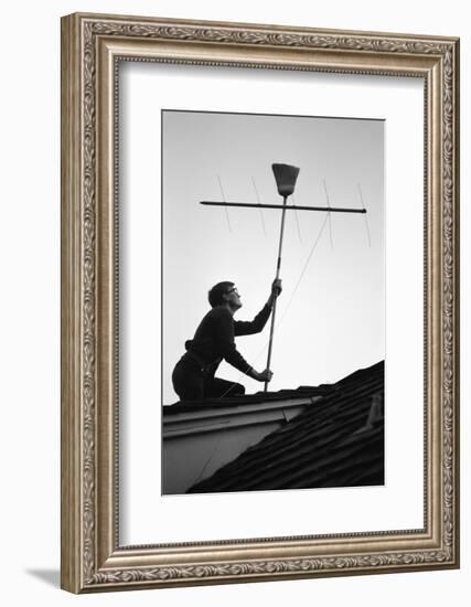 1967: Man Using a Broom to Improve the Antennae Reception During the Broadcast of Super Bowl I-Bill Ray-Framed Photographic Print