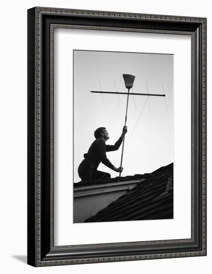 1967: Man Using a Broom to Improve the Antennae Reception During the Broadcast of Super Bowl I-Bill Ray-Framed Photographic Print