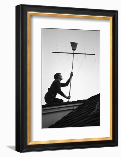 1967: Man Using a Broom to Improve the Antennae Reception During the Broadcast of Super Bowl I-Bill Ray-Framed Photographic Print