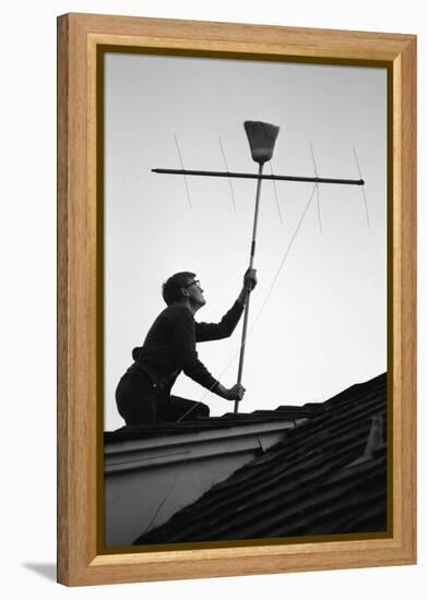 1967: Man Using a Broom to Improve the Antennae Reception During the Broadcast of Super Bowl I-Bill Ray-Framed Premier Image Canvas