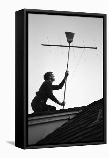 1967: Man Using a Broom to Improve the Antennae Reception During the Broadcast of Super Bowl I-Bill Ray-Framed Premier Image Canvas