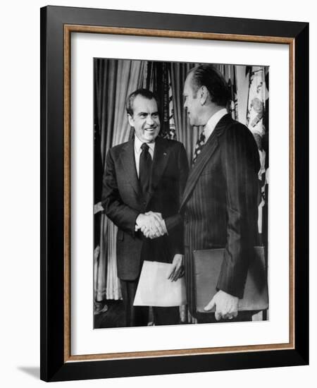 1973 US Presidency, President Richard Nixon Shakes Hands with New Vice President Gerald Ford, 1973-null-Framed Photo