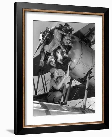 20 Year Old Women and Expert Aviation Mechanic Working on a Wright Whirlwind Airplane Motor-null-Framed Photo