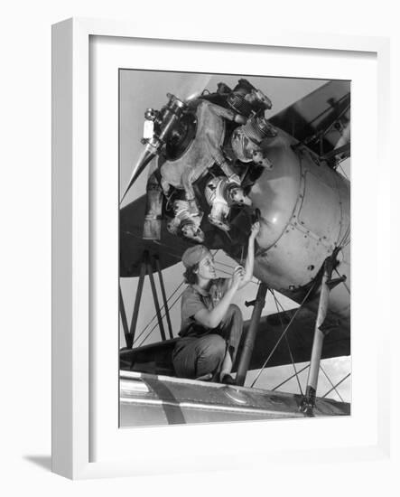 20 Year Old Women and Expert Aviation Mechanic Working on a Wright Whirlwind Airplane Motor-null-Framed Photo