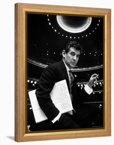 36 Year Old Composer Leonard Bernstein, Holding Musical Score with Lighted Auditorium Behind Him-Gordon Parks-Framed Premier Image Canvas