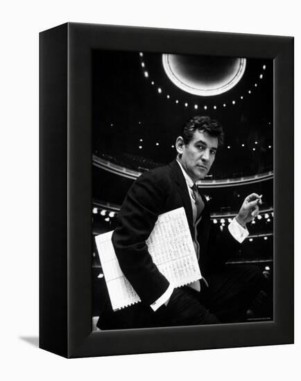 36 Year Old Composer Leonard Bernstein, Holding Musical Score with Lighted Auditorium Behind Him-Gordon Parks-Framed Premier Image Canvas