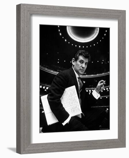 36 Year Old Composer Leonard Bernstein, Holding Musical Score with Lighted Auditorium Behind Him-Gordon Parks-Framed Premium Photographic Print