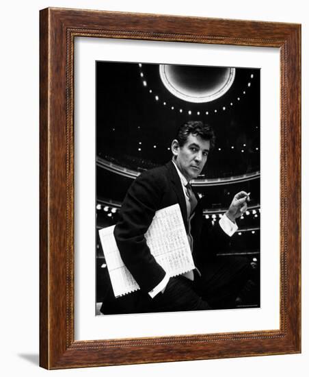 36 Year Old Composer Leonard Bernstein, Holding Musical Score with Lighted Auditorium Behind Him-Gordon Parks-Framed Premium Photographic Print