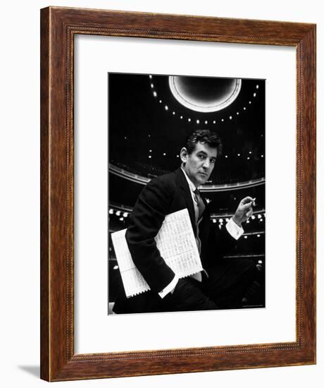 36 Year Old Composer Leonard Bernstein, Holding Musical Score with Lighted Auditorium Behind Him-Gordon Parks-Framed Premium Photographic Print