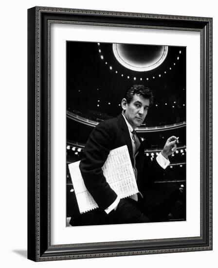 36 Year Old Composer Leonard Bernstein, Holding Musical Score with Lighted Auditorium Behind Him-Gordon Parks-Framed Premium Photographic Print