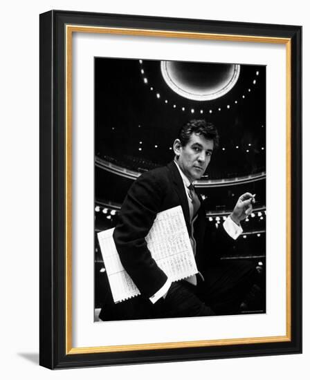 36 Year Old Composer Leonard Bernstein, Holding Musical Score with Lighted Auditorium Behind Him-Gordon Parks-Framed Premium Photographic Print