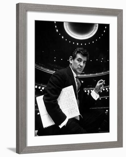 36 Year Old Composer Leonard Bernstein, Holding Musical Score with Lighted Auditorium Behind Him-Gordon Parks-Framed Premium Photographic Print
