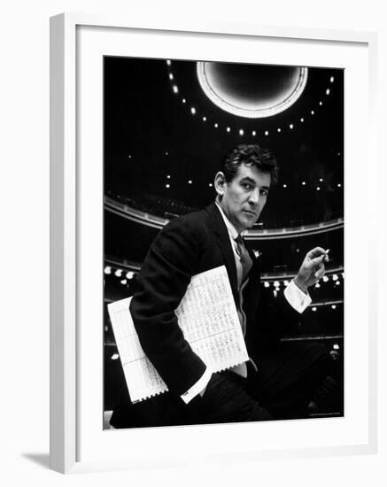 36 Year Old Composer Leonard Bernstein, Holding Musical Score with Lighted Auditorium Behind Him-Gordon Parks-Framed Premium Photographic Print