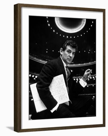 36 Year Old Composer Leonard Bernstein, Holding Musical Score with Lighted Auditorium Behind Him-Gordon Parks-Framed Premium Photographic Print