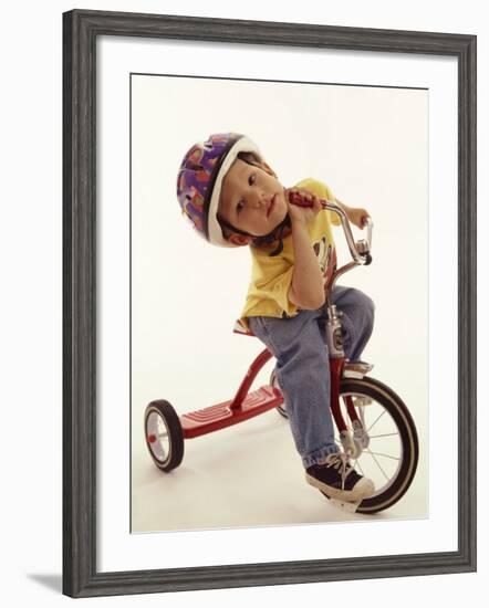 4 Year Old Boy Posing on His Tricycle, New York, New York, USA-Paul Sutton-Framed Photographic Print