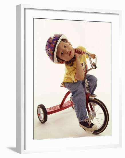 4 Year Old Boy Posing on His Tricycle, New York, New York, USA-Paul Sutton-Framed Photographic Print