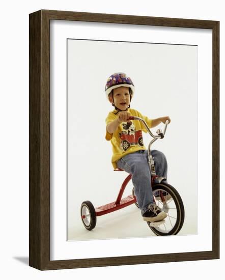 4 Year Old Boy Posing on His Tricycle, New York, New York, USA-Paul Sutton-Framed Photographic Print