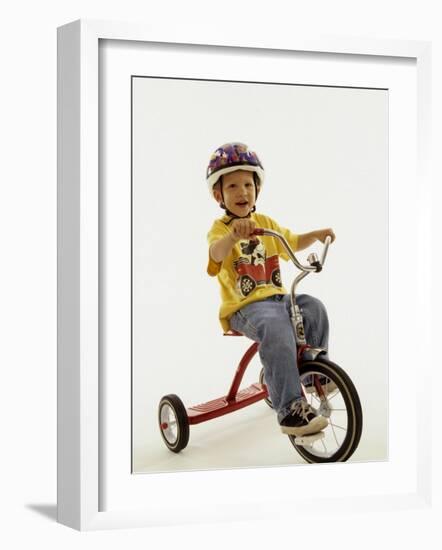 4 Year Old Boy Posing on His Tricycle, New York, New York, USA-Paul Sutton-Framed Photographic Print