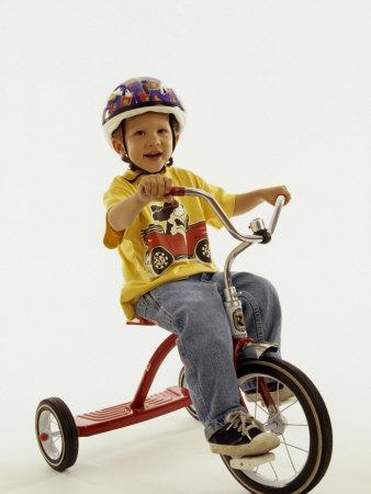 4 Year Old Boy Posing on His Tricycle New York New York USA