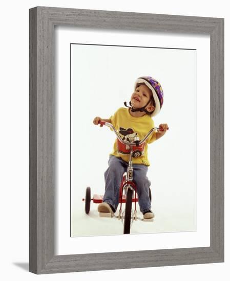 4 Year Old Boy Posing on His Tricycle, New York, New York, USA-Paul Sutton-Framed Photographic Print