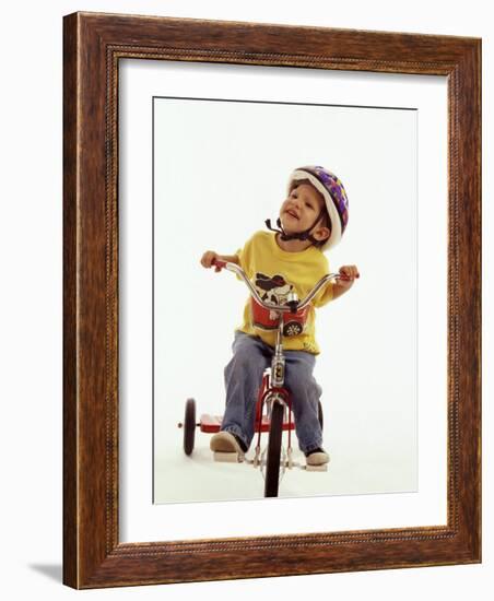 4 Year Old Boy Posing on His Tricycle, New York, New York, USA-Paul Sutton-Framed Photographic Print