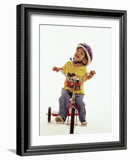 4 Year Old Boy Posing on His Tricycle, New York, New York, USA-Paul Sutton-Framed Photographic Print