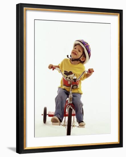 4 Year Old Boy Posing on His Tricycle, New York, New York, USA-Paul Sutton-Framed Photographic Print