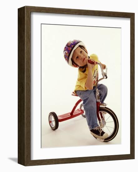 4 Year Old Boy Posing on His Tricycle, New York, New York, USA-Paul Sutton-Framed Photographic Print