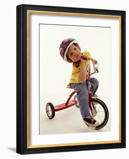 4 Year Old Boy Posing on His Tricycle, New York, New York, USA-Paul Sutton-Framed Photographic Print