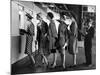 5 Models Wearing Fashionable Dress Suits at a Race Track Betting Window, at Roosevelt Raceway-Nina Leen-Mounted Premium Photographic Print