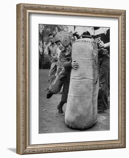 7 Year Old Tackling Dummy During Practice-Wallace Kirkland-Framed Photographic Print