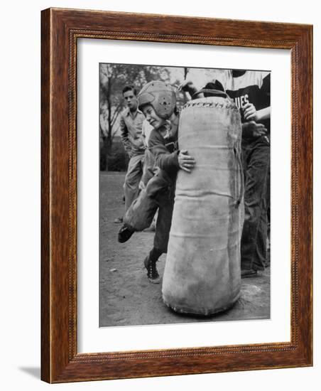 7 Year Old Tackling Dummy During Practice-Wallace Kirkland-Framed Photographic Print