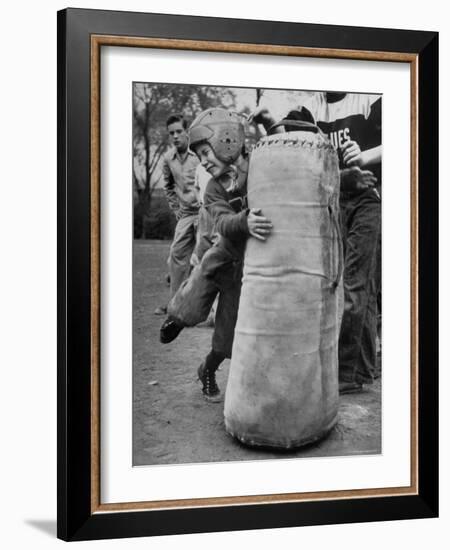 7 Year Old Tackling Dummy During Practice-Wallace Kirkland-Framed Photographic Print