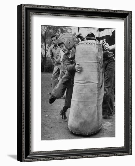 7 Year Old Tackling Dummy During Practice-Wallace Kirkland-Framed Photographic Print