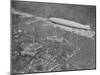 750 Foot Long Graf Zeppelin LZ 127 Flying Above British Capital-null-Mounted Photographic Print