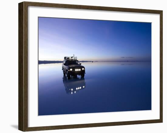 A 4X4 Rests in the Early Am Reflection in a Flooded Salt Flat In-Sergio Ballivian-Framed Photographic Print